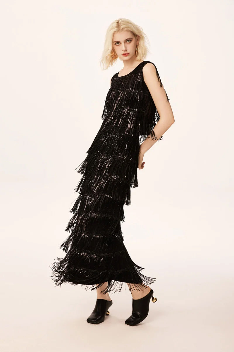 Model wearing black sequin fringe skirt, elegant versatile outfit for party and evening occasions