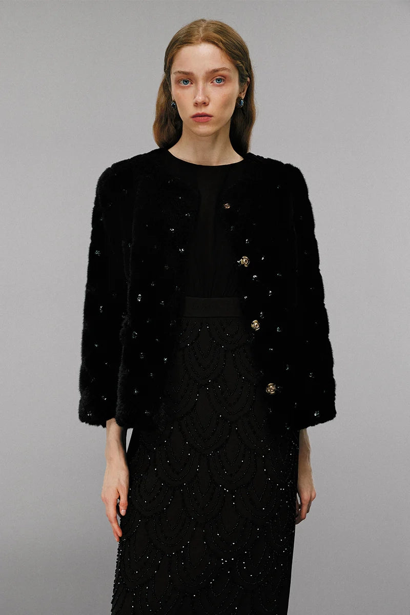 Model wearing embellished wool coat