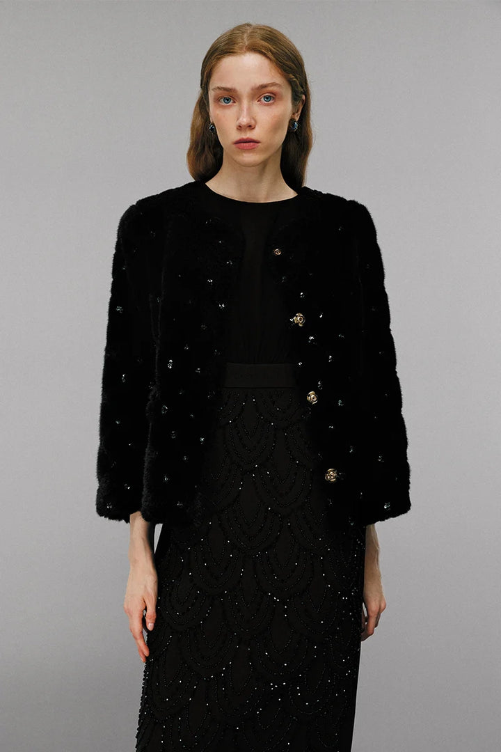 Model wearing embellished wool coat