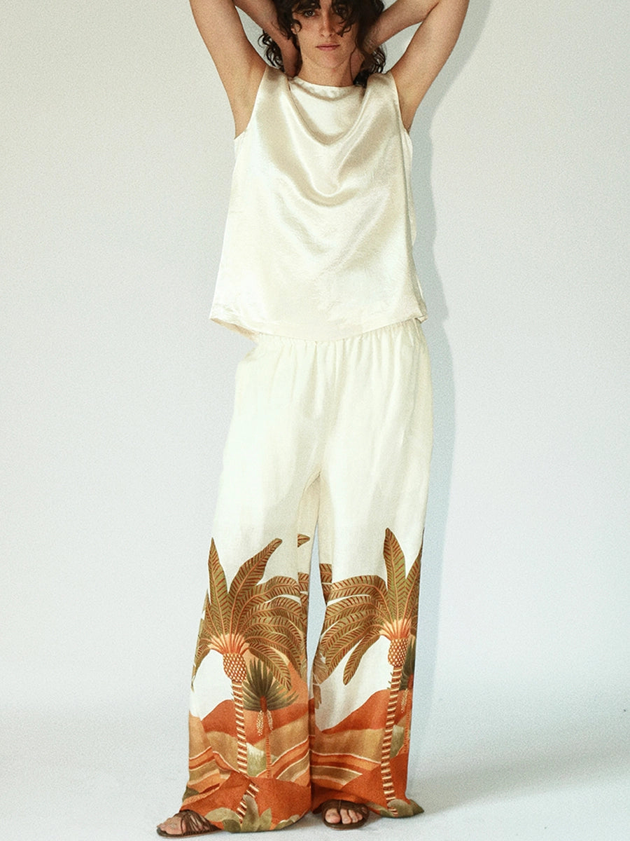 Model wearing Solelegia tropical wide-leg pants