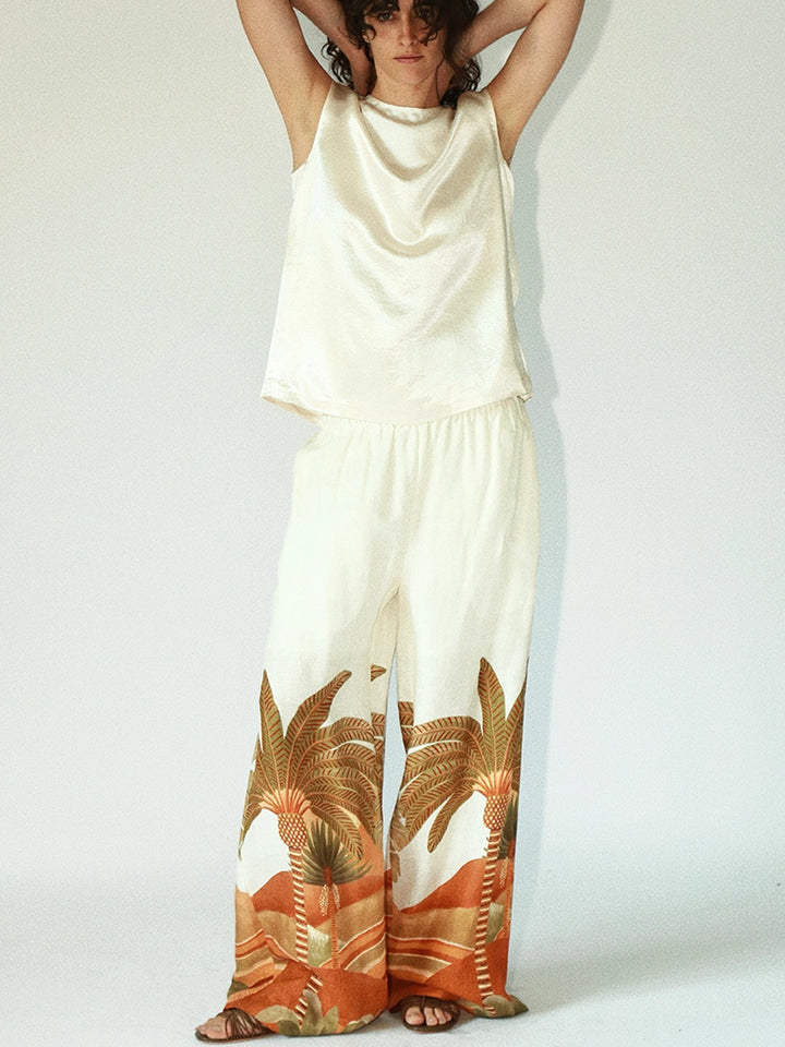 Model wearing Solelegia tropical wide-leg pants