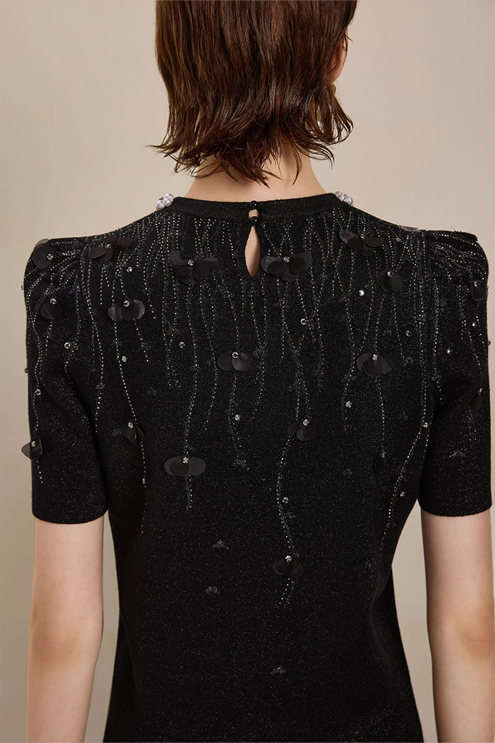 Back view of Solelegia luxury puff sleeve jacquard top with pearls and crystals
