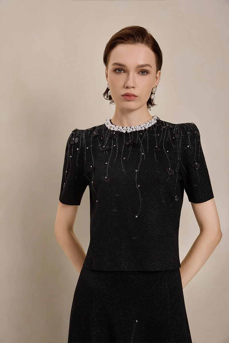 Detail view of Solelegia luxury puff sleeve jacquard top with pearls and crystals