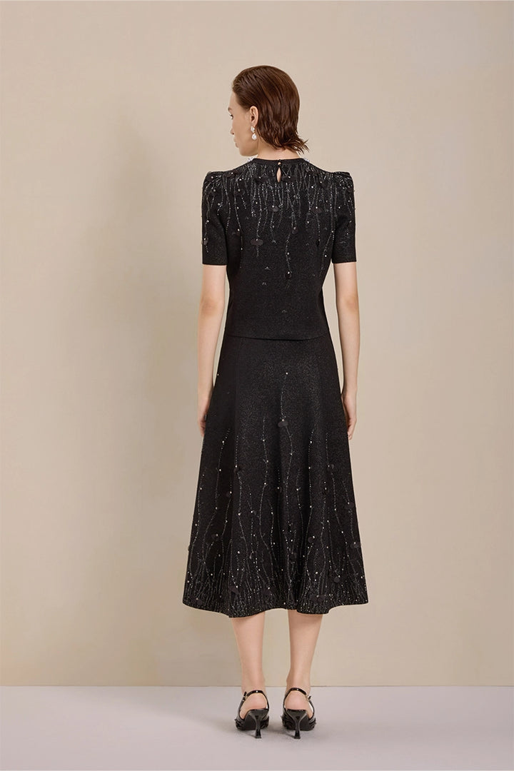 Back view of Solelegia luxury wool knit jacquard midi skirt with pearls and crystals
