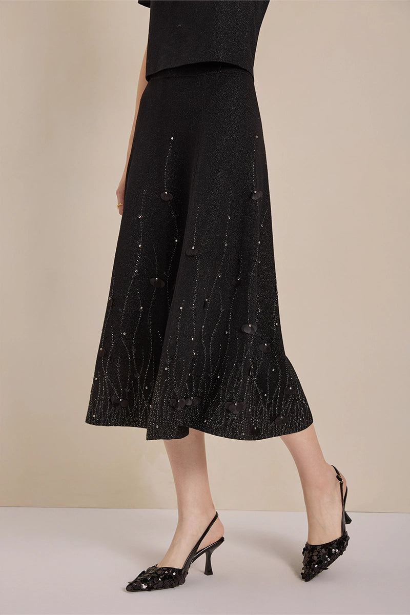 Detail view of Solelegia luxury wool knit jacquard midi skirt with pearls and crystals