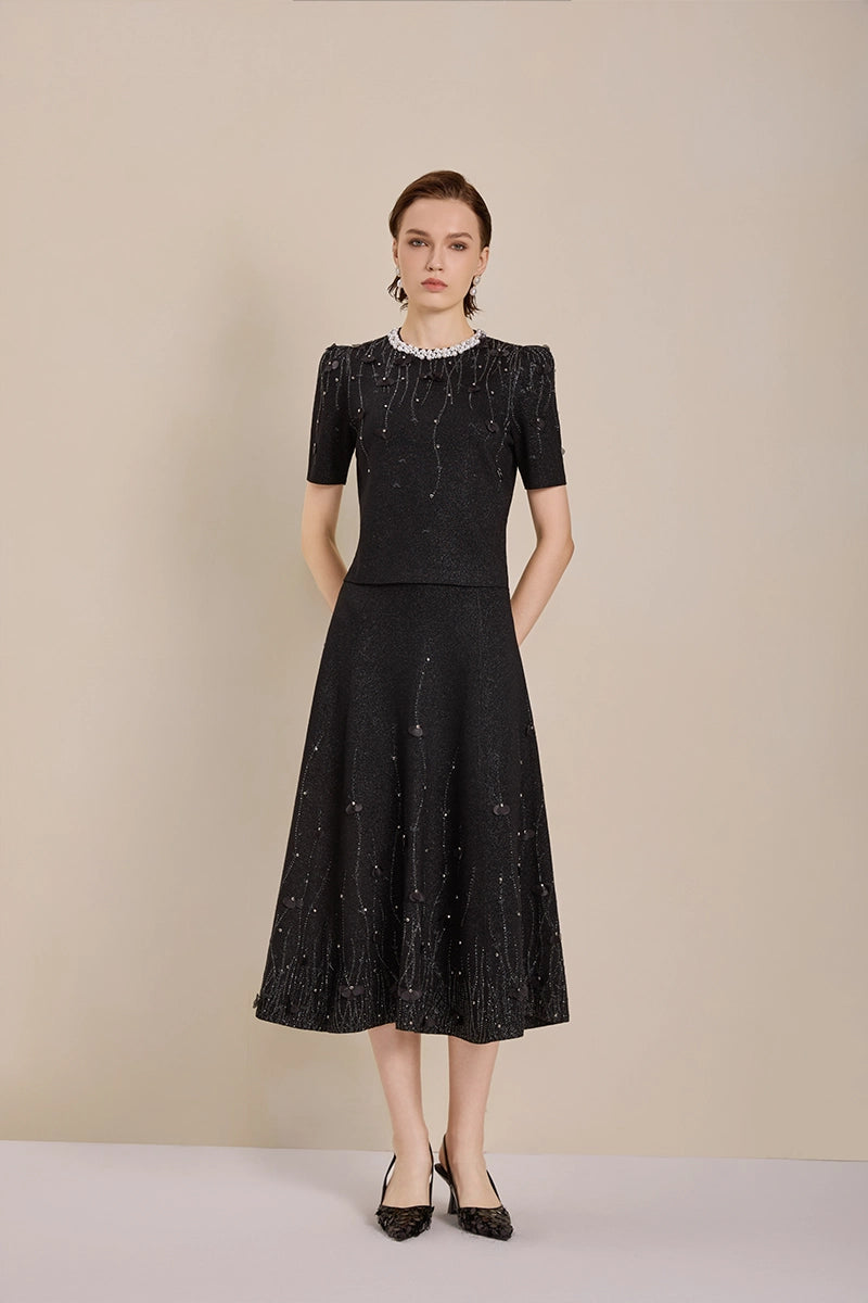 Model view of Solelegia luxury wool knit jacquard midi skirt with pearls and crystals