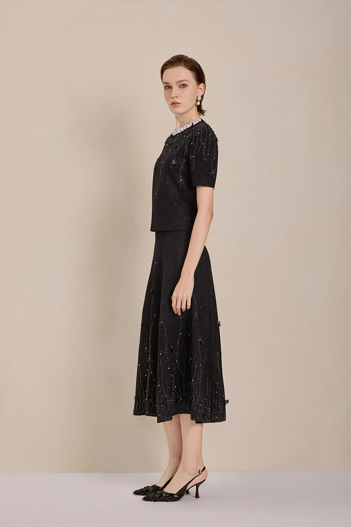 Side view of Solelegia luxury wool knit jacquard midi skirt with pearls and crystals