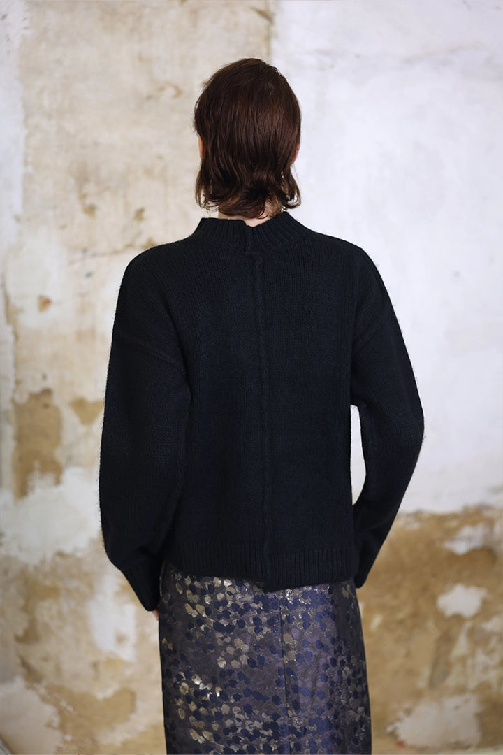 Back view of Solelegia Round Neck Long Sleeve Knit Top