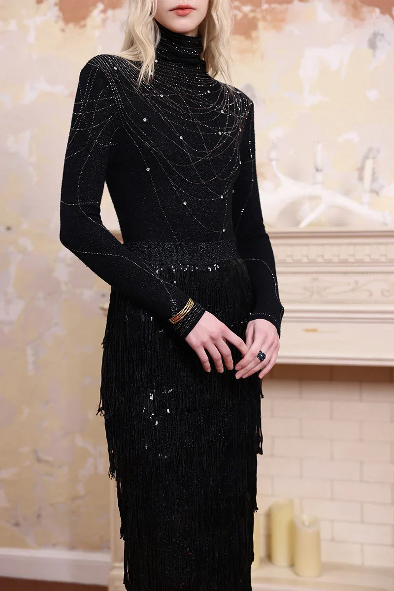 Close-up of Solelegia sparkling embellished turtleneck knit top, rhinestone details and fine knit texture