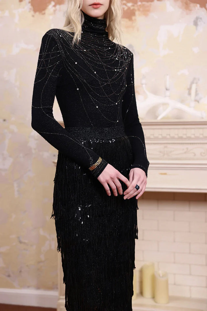 Close-up of Solelegia sparkling embellished turtleneck knit top, rhinestone details and fine knit texture