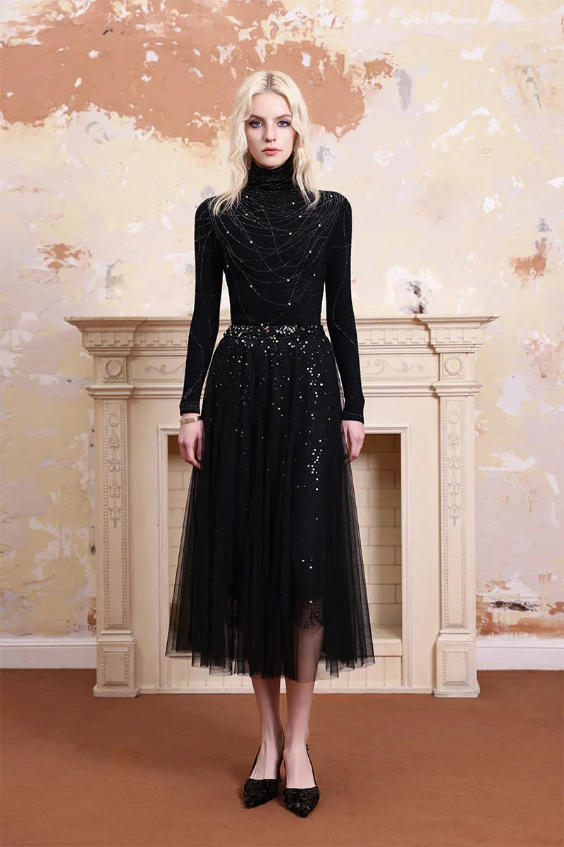 Model wearing Solelegia sparkling embellished turtleneck knit top, elegant outfit