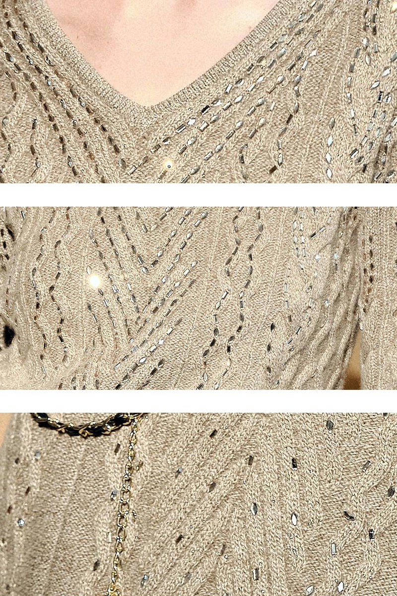 Close-up of V-neck cable knit and silver thread shimmer on Solelegia Knit Sweater