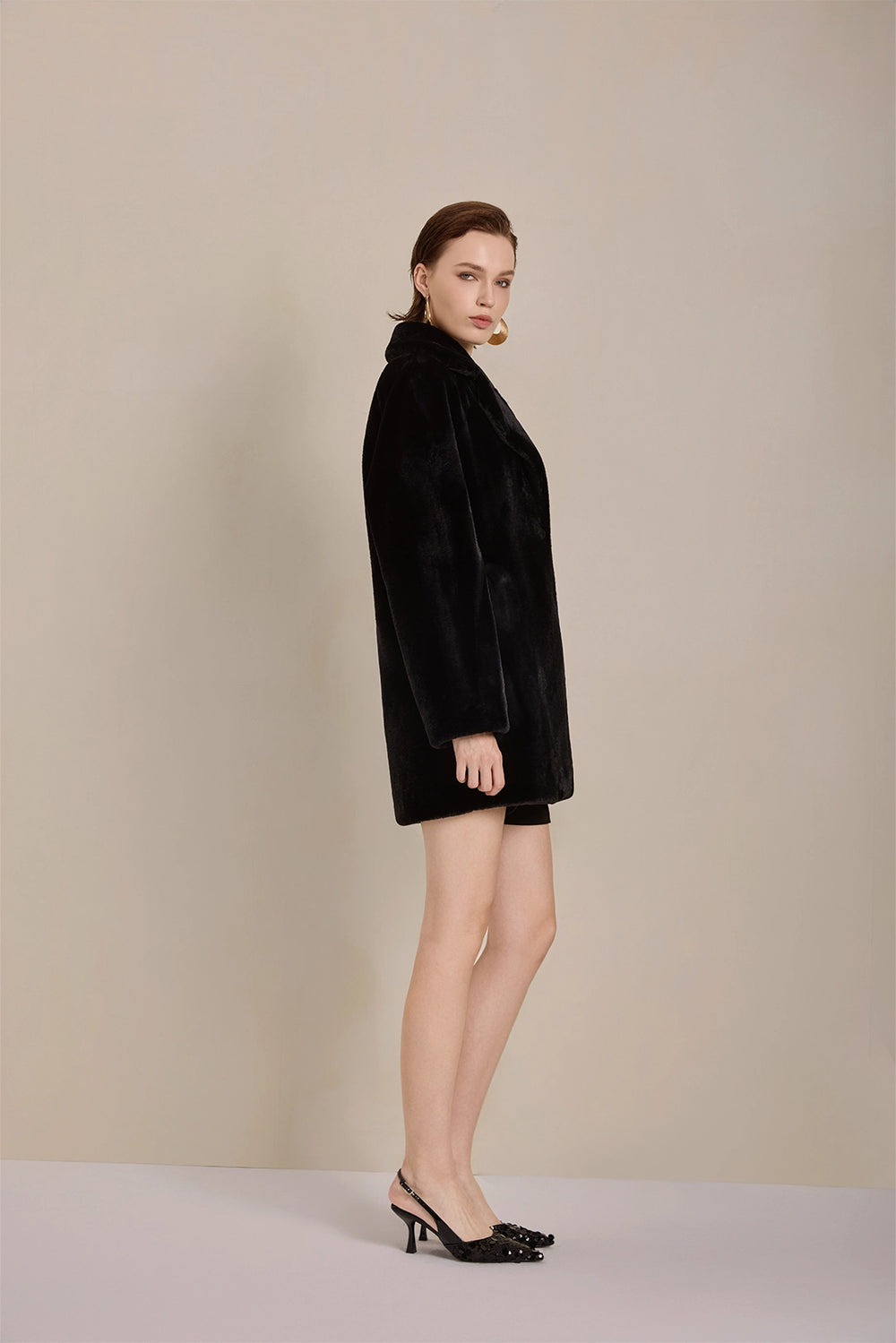 Side view of Solelegia Women's Elegant Faux Fur Coat